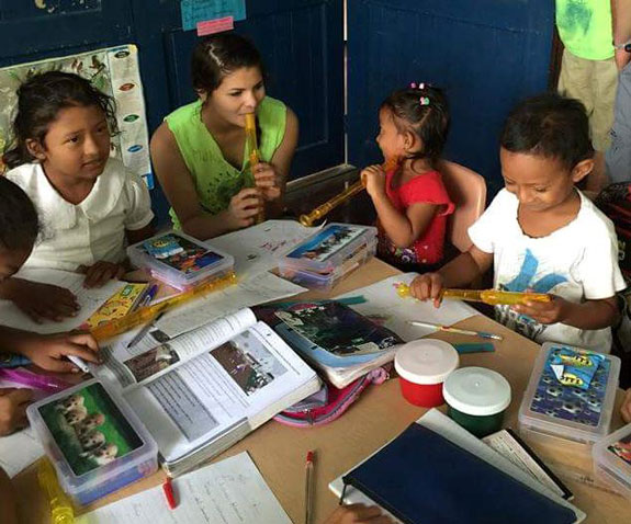 Students at Local School Working With Volunteer Students
