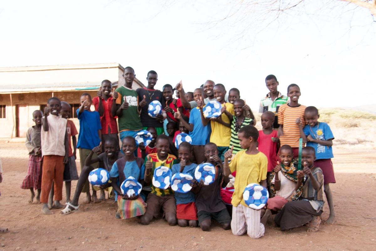 Children with soccer balls