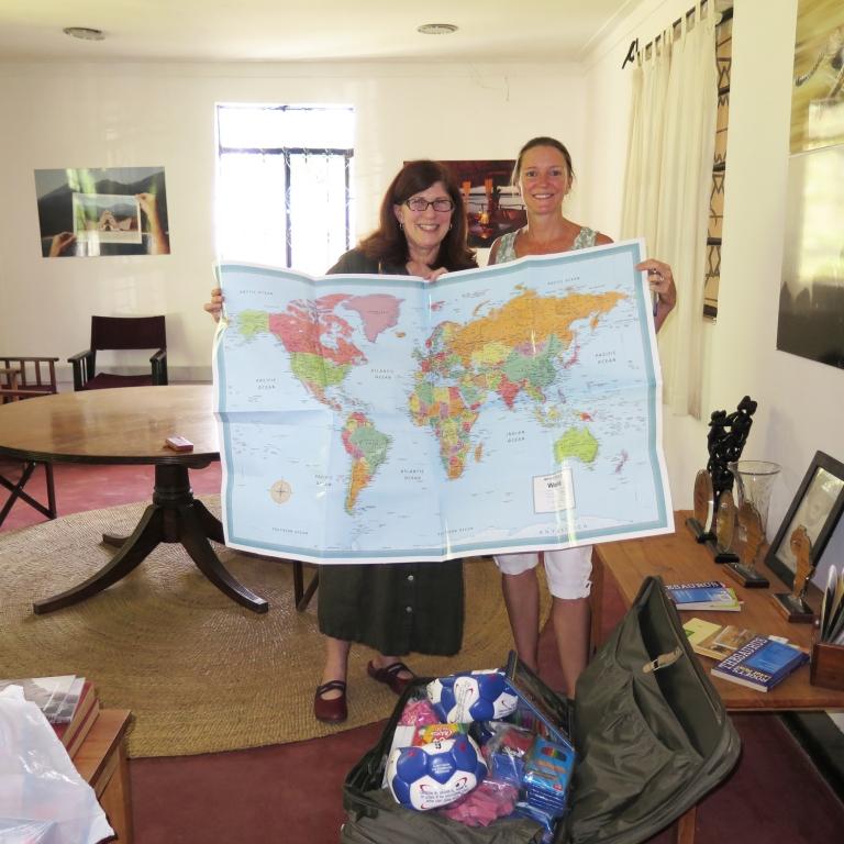 Amanda and Rebecca with supplies delivered to Nomad Tanzania