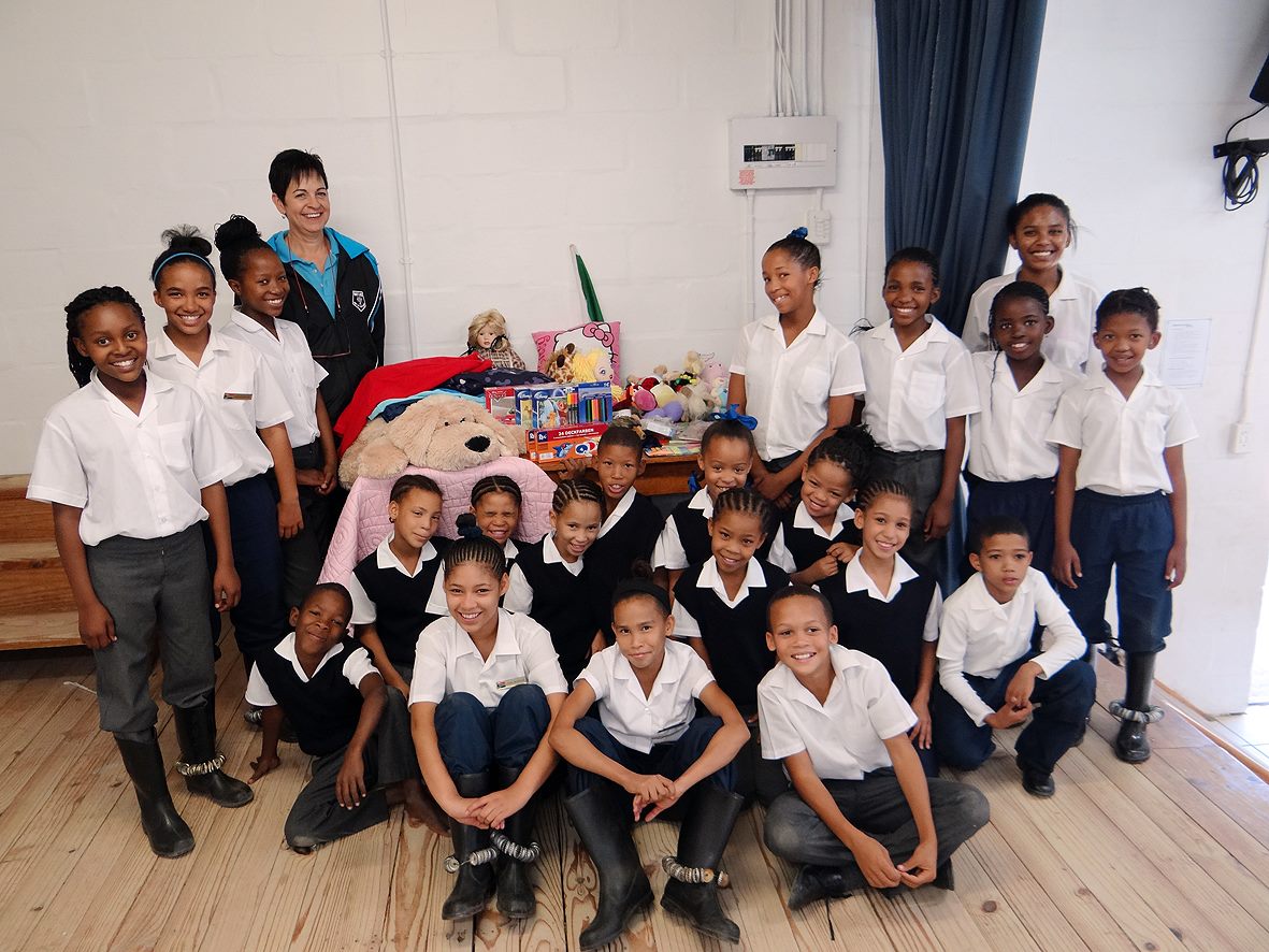 Guests with students and supplies at Elizabethfontein Primary School