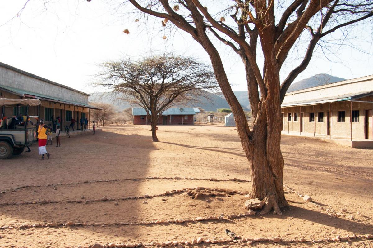 The inside courtyard and the original classroom by the tree, outlined by rocks